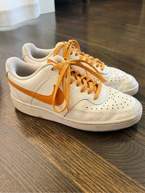 Nike Low-Top Sneakers in Cream with Orange Swoosh and Laces